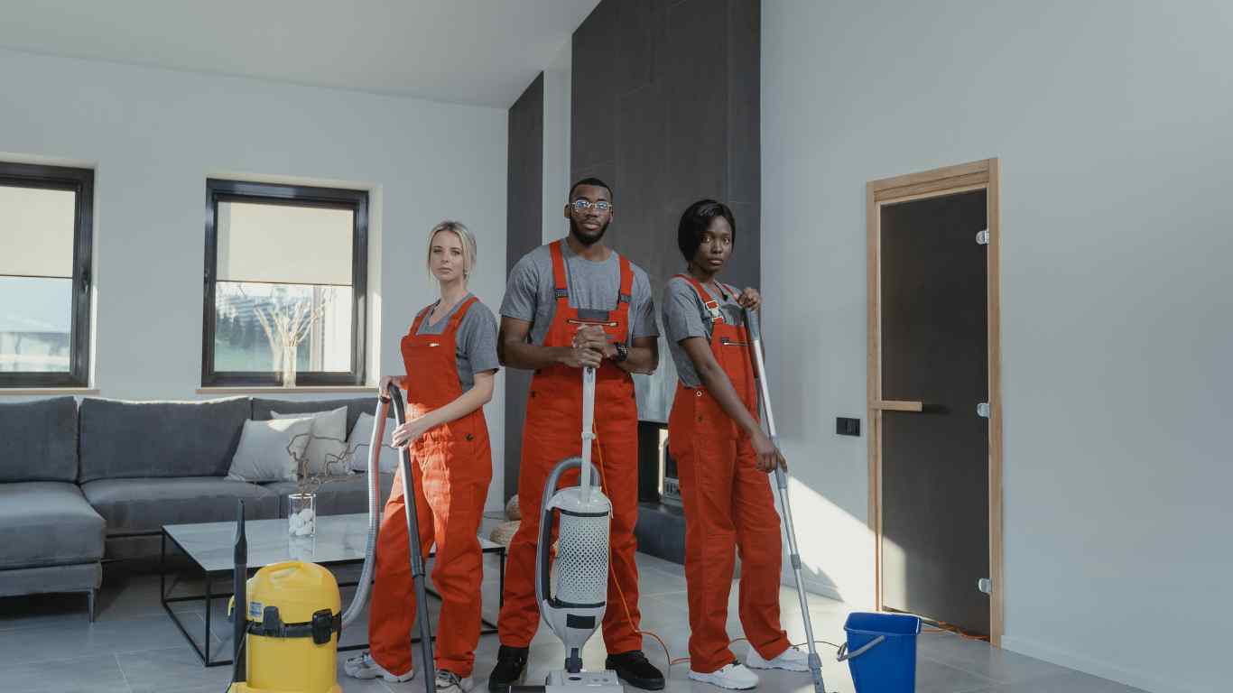 Smiling Cleaning Team in Uniforms