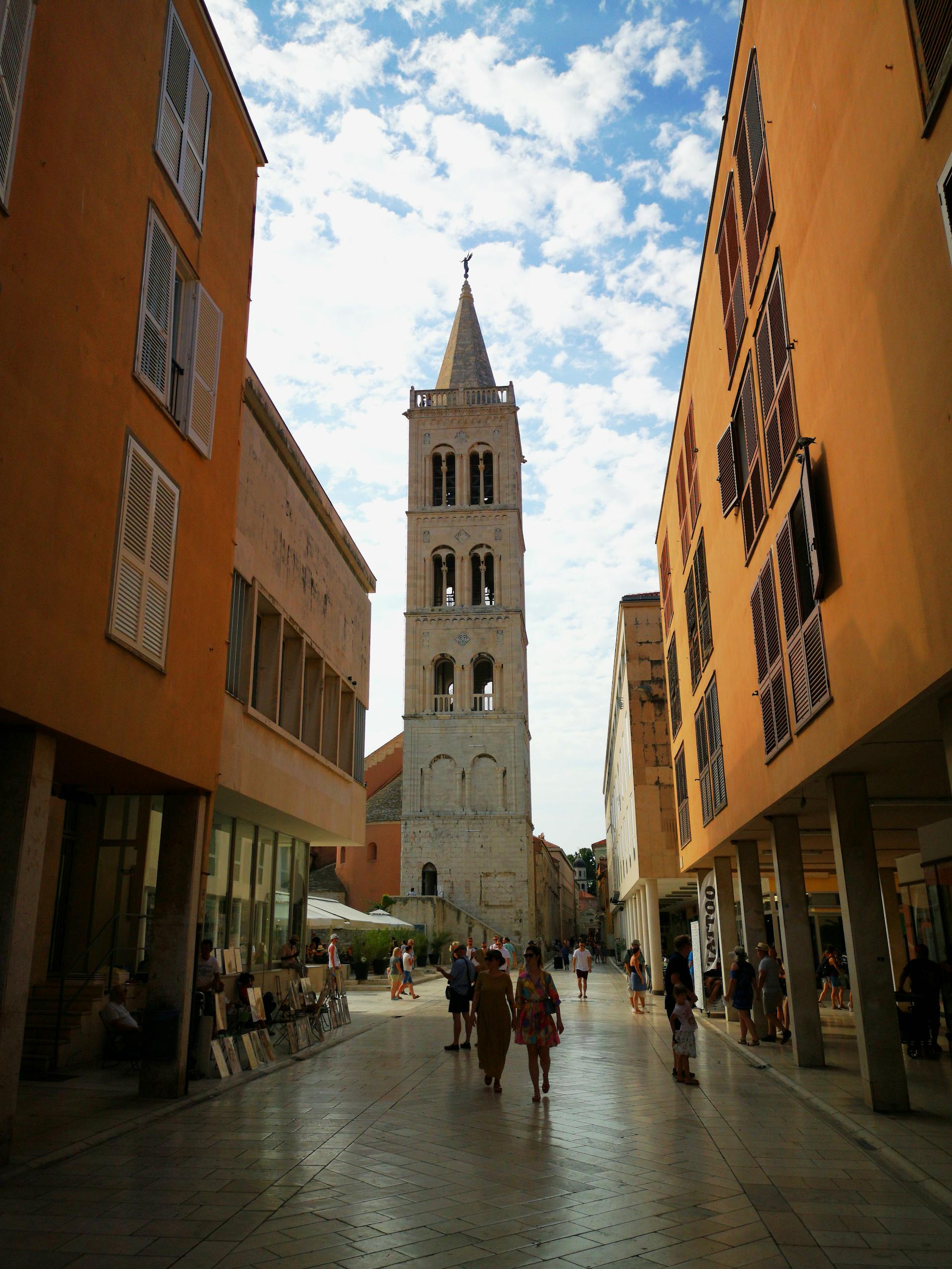 St. Augustine 2 Captured in Zadar, this image shows people walking towards the stunning bell tower on a sunny day.