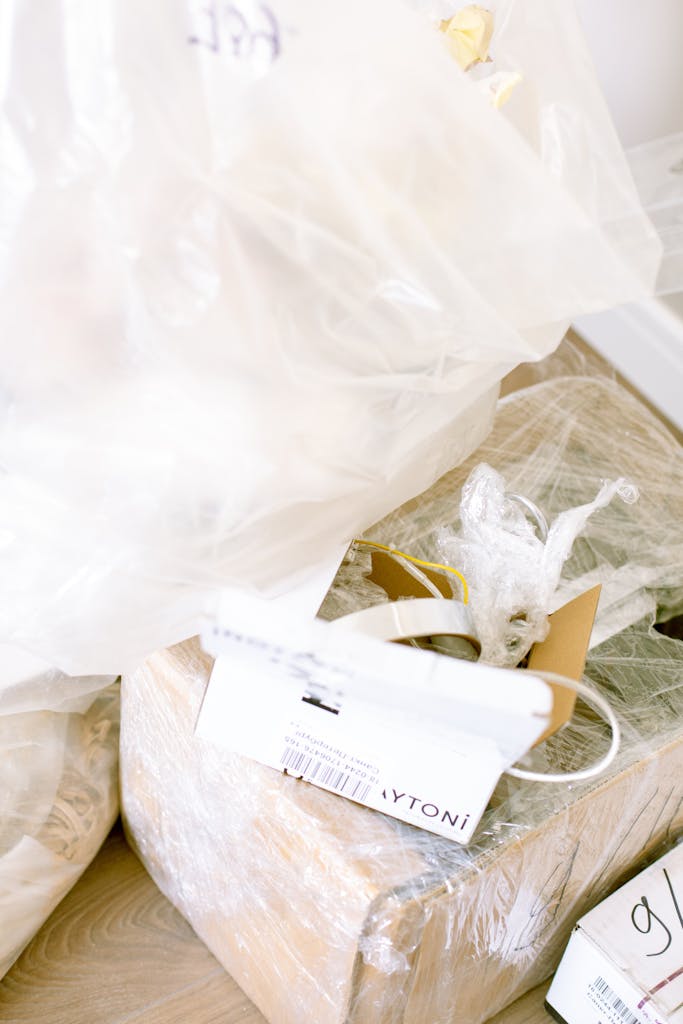 Plastic-wrapped boxes and supplies for moving or renovation in a home setting.