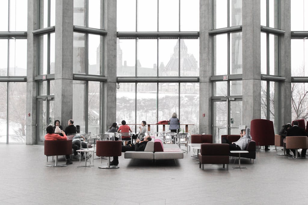 St. Augustine 16 Spacious lounge with modern decor and large windows showcasing a snowy Ottawa view.